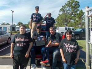 Nate and his friends pose for a photo while on set for his music video.