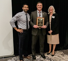Award winner Matt Susin (center)